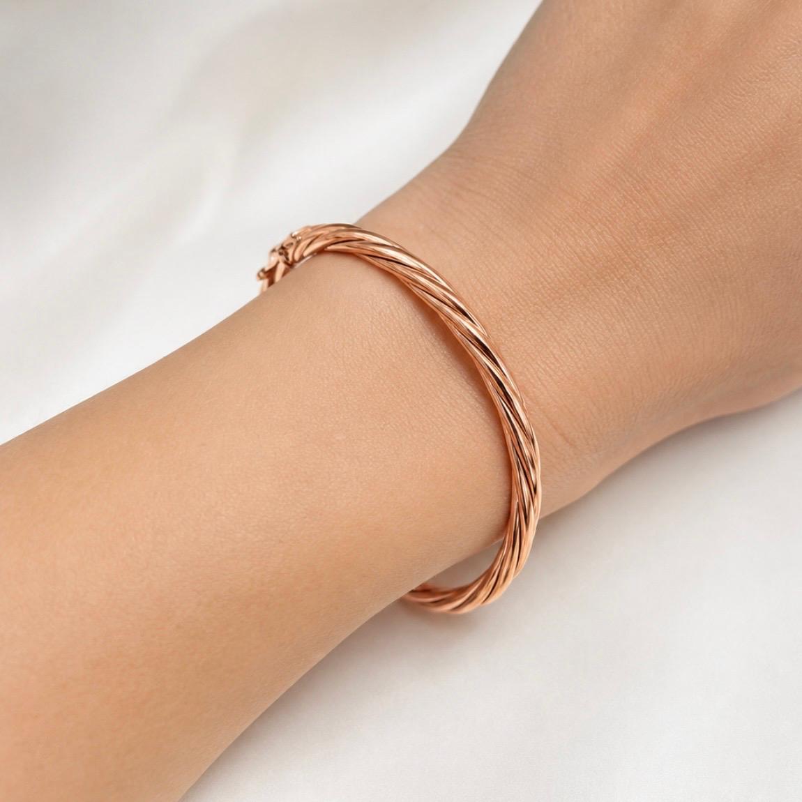 PULSERA ESCLAVA TORSIONADA EN ORO ROSA 18K
