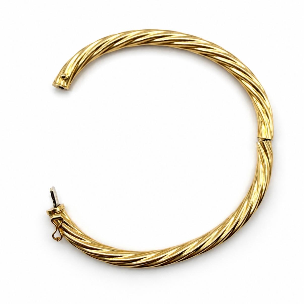 PULSERA ESCLAVA TORSIONADA EN ORO 18K