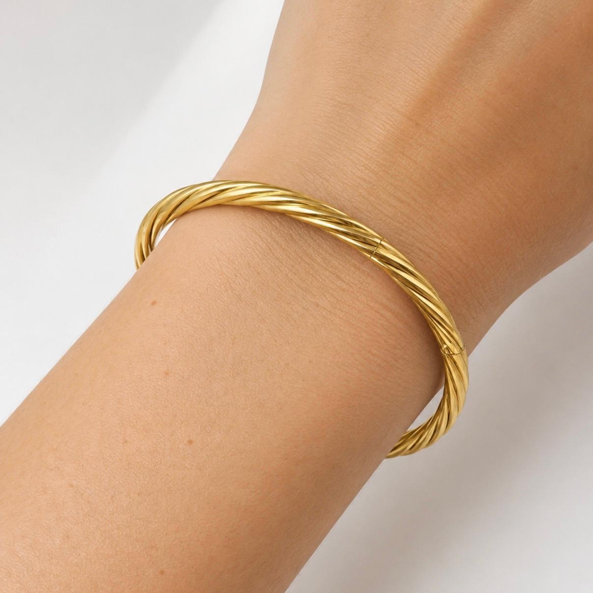 PULSERA ESCLAVA TORSIONADA EN ORO 18K