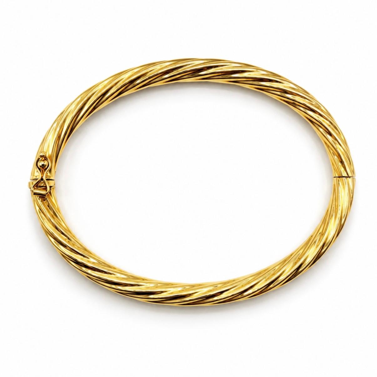 PULSERA ESCLAVA TORSIONADA EN ORO 18K
