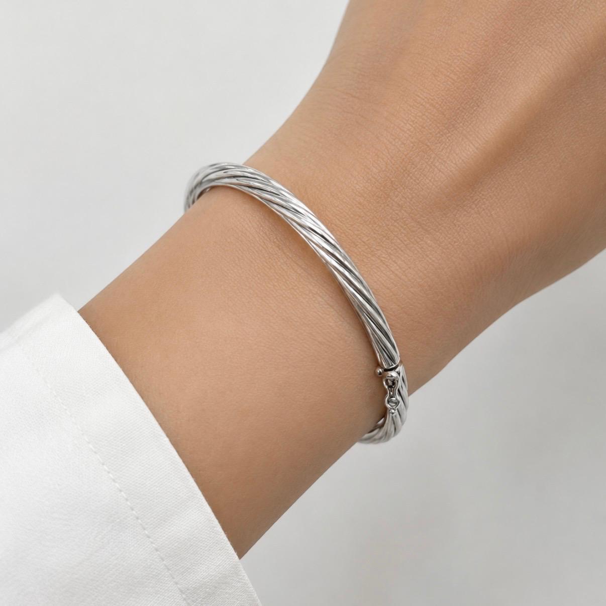 PULSERA ESCLAVA TORSIONADA EN ORO BLANCO 18K